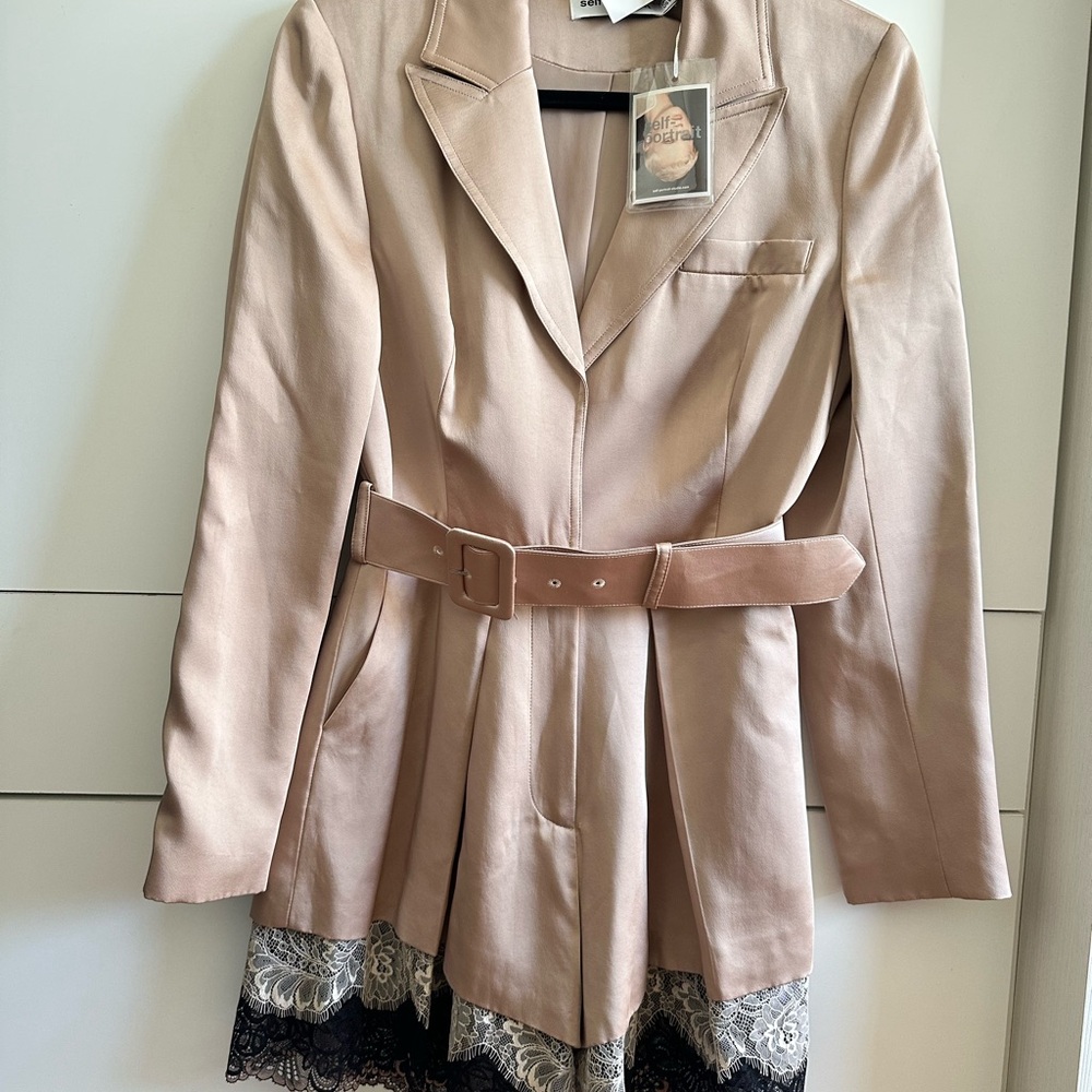 Romper brand new with tags. Never worn